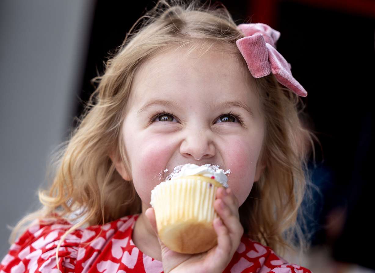 Estelle Santiago eats a cupcake at the Intermountain Health Flight & Ambulance Hangar in Salt Lake City on Wednesday.