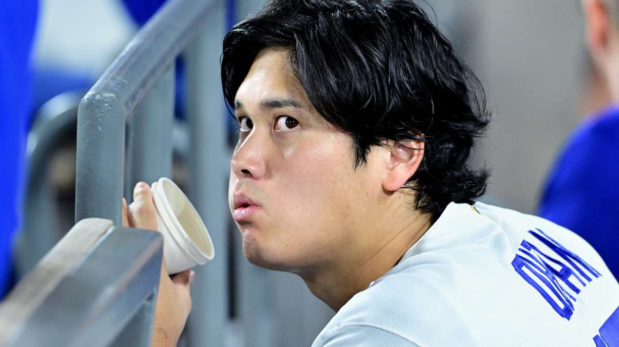 Los Angeles Dodgers Shohei Ohtani (17) watches from the dugout during the seventh inning of a baseball game against the Seattle Mariners, Tuesday, July 28 2026, in Los Angeles.