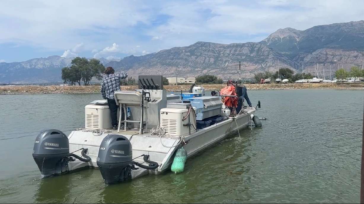 UVU's algae boat leaves the dock at Utah Lake on Wednesday. The one-of-a-kind boat designed by students and faculty to combat harmful algae blooms on Utah Lake could be entering its final season on the water.