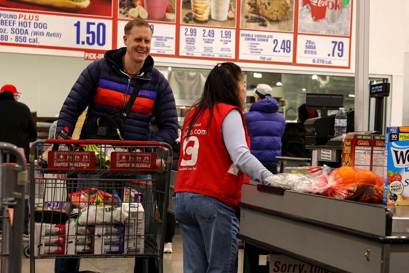 People shop at a Costco in New York City, Jan. 16. The U.S. economy likely maintained a steady pace of growth in the second quarter, supported by stronger consumer spending and business investment in equipment tied to the buildout of AI infrastructure.
