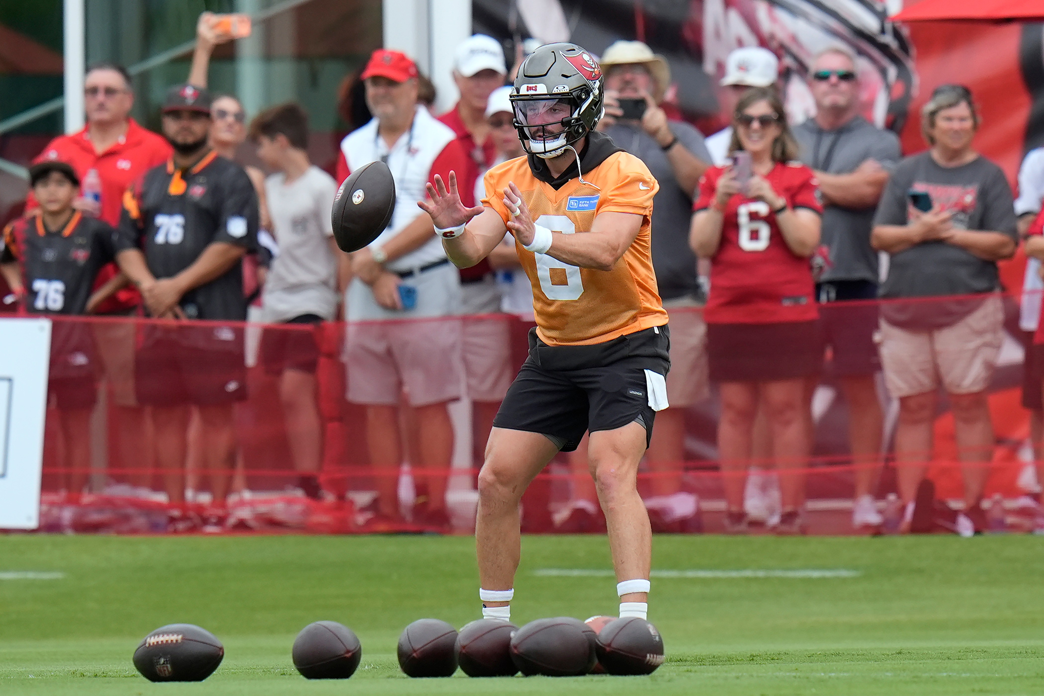 Tampa Bay Buccaneers quarterback Baker Mayfield takes a snap during an NFL football training camp practice Thursday, July 30, 2026, in Tampa, Fla. 
