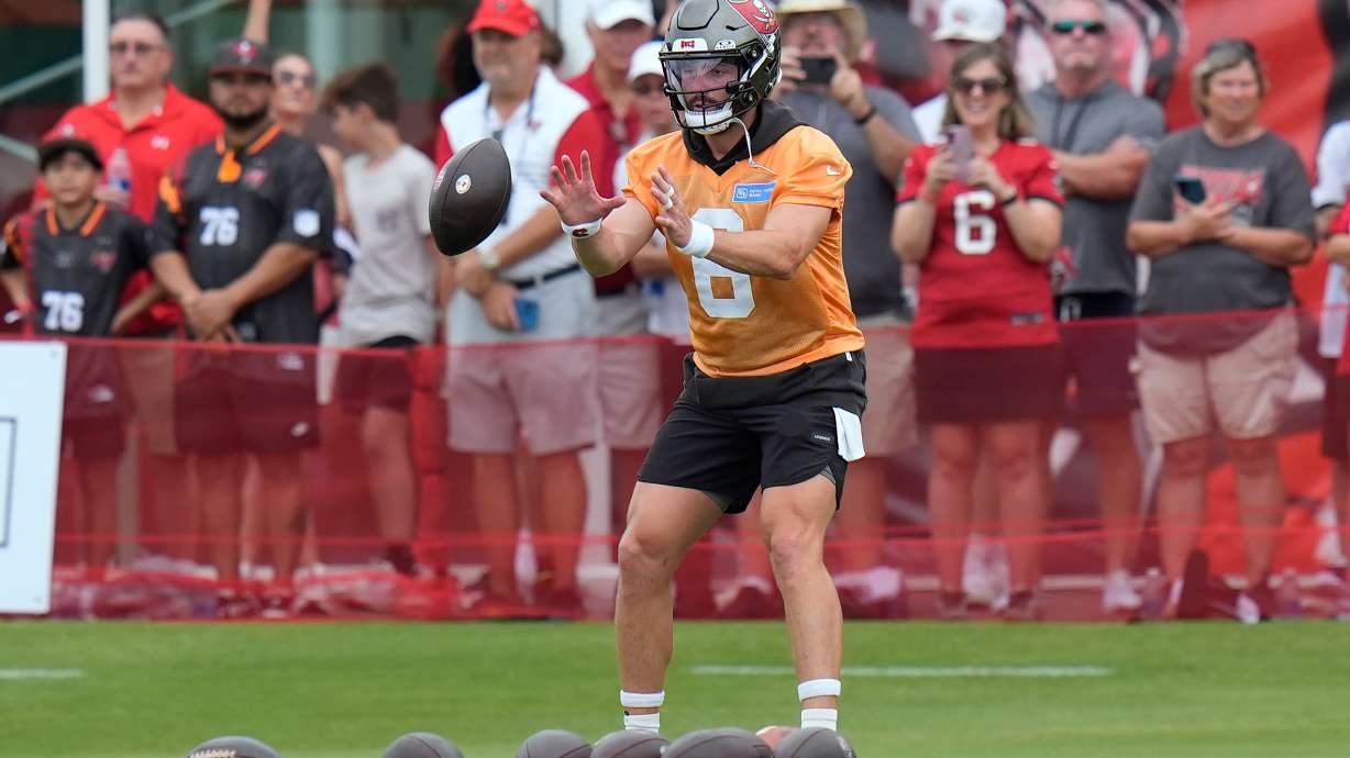 Tampa Bay Buccaneers quarterback Baker Mayfield takes a snap during an NFL football training camp practice Thursday, July 30, 2026, in Tampa, Fla.