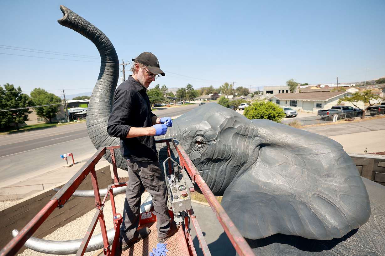 Matthew Gray Palmer makes a bullseye level which will be used to help transport and set up Yumi, a roughly 18,000-pound bronze elephant Palmer has been sculpting and building for seven years, at Metal Art Foundry in Lehi on Thursday.