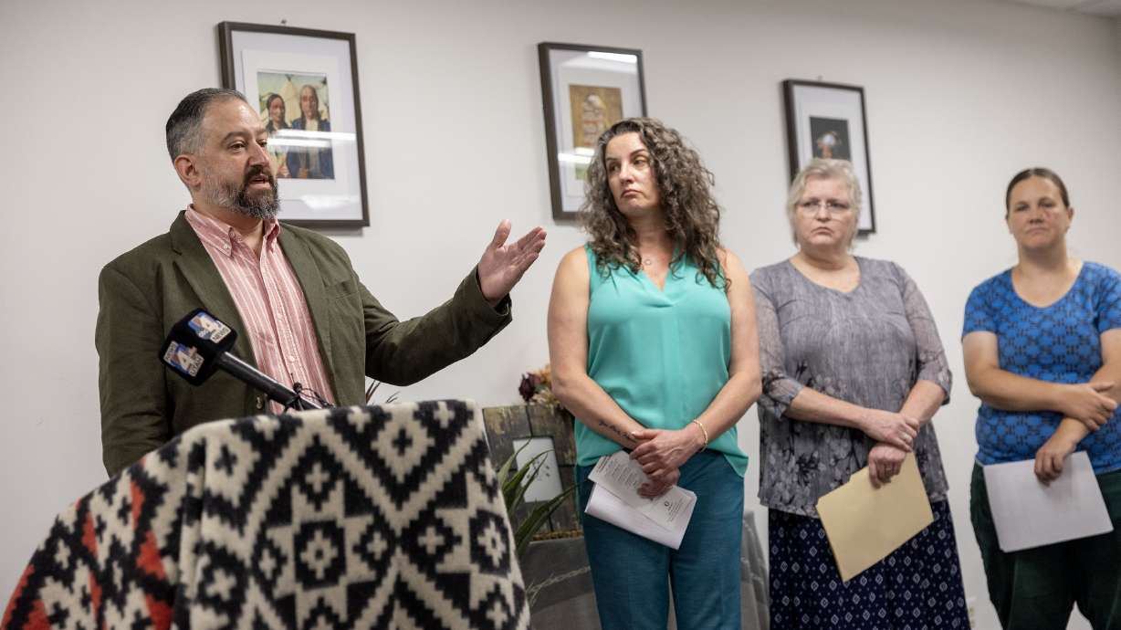 Nate Crippes, public affairs supervising attorney at the Disability Law Center, left, speaks with child welfare advocate Ronni Bateman, Medicaid recipient Brenda Oluwalana, and substitute teacher Stephanie Foster during a press conference concerning the need to protect Medicaid in Salt Lake City on Thursday.