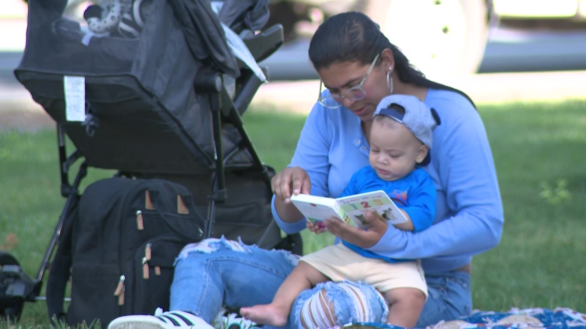 A mother is pictured reading to her child at an event focused on building early literacy in South Salt Lake on Thursday.