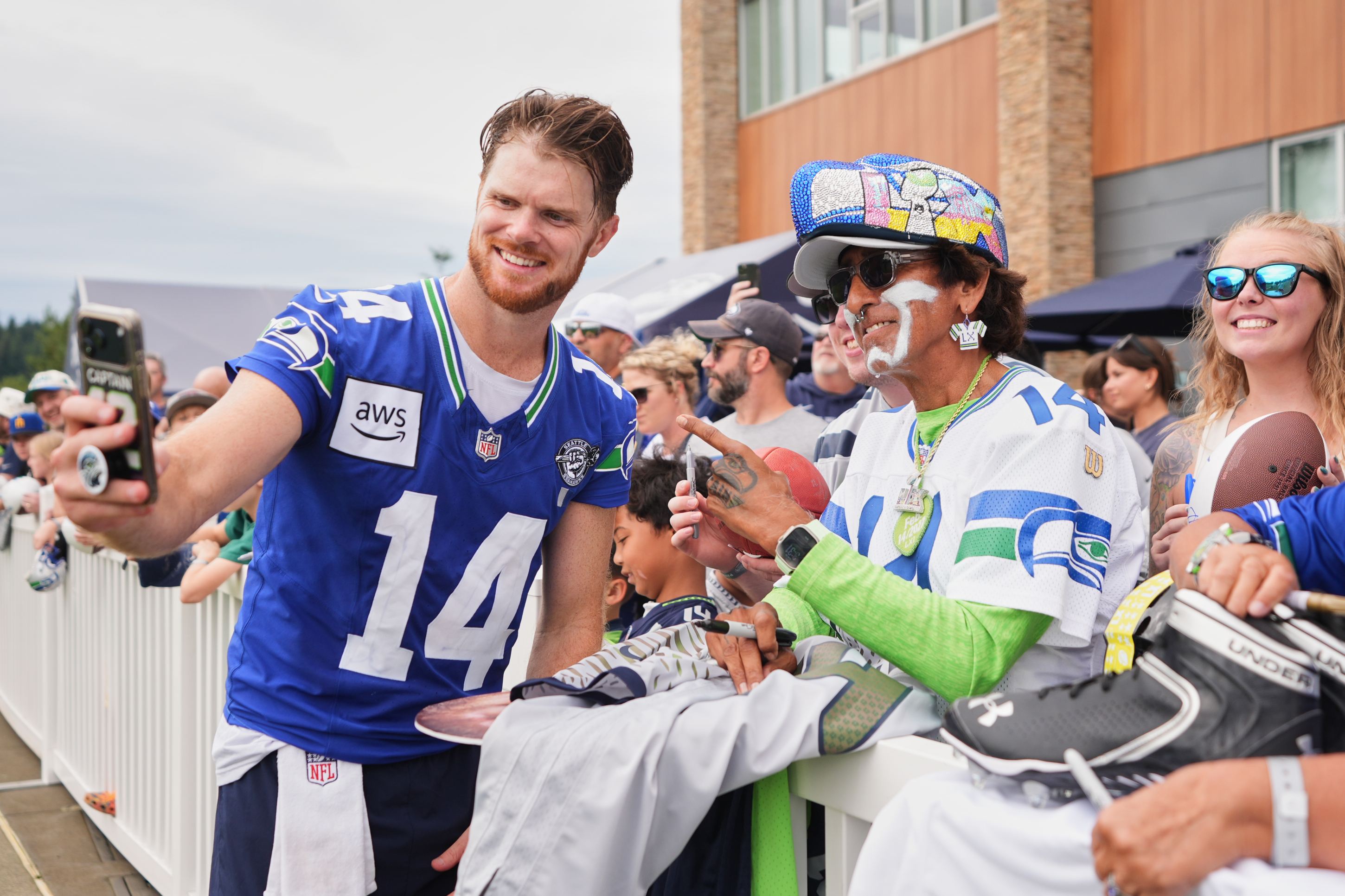 Seattle Seahawks quarterback Sam Darnold takes a selfie during the NFL football team's training camp, Sunday, July 26, 2026, in Renton, Wash. 