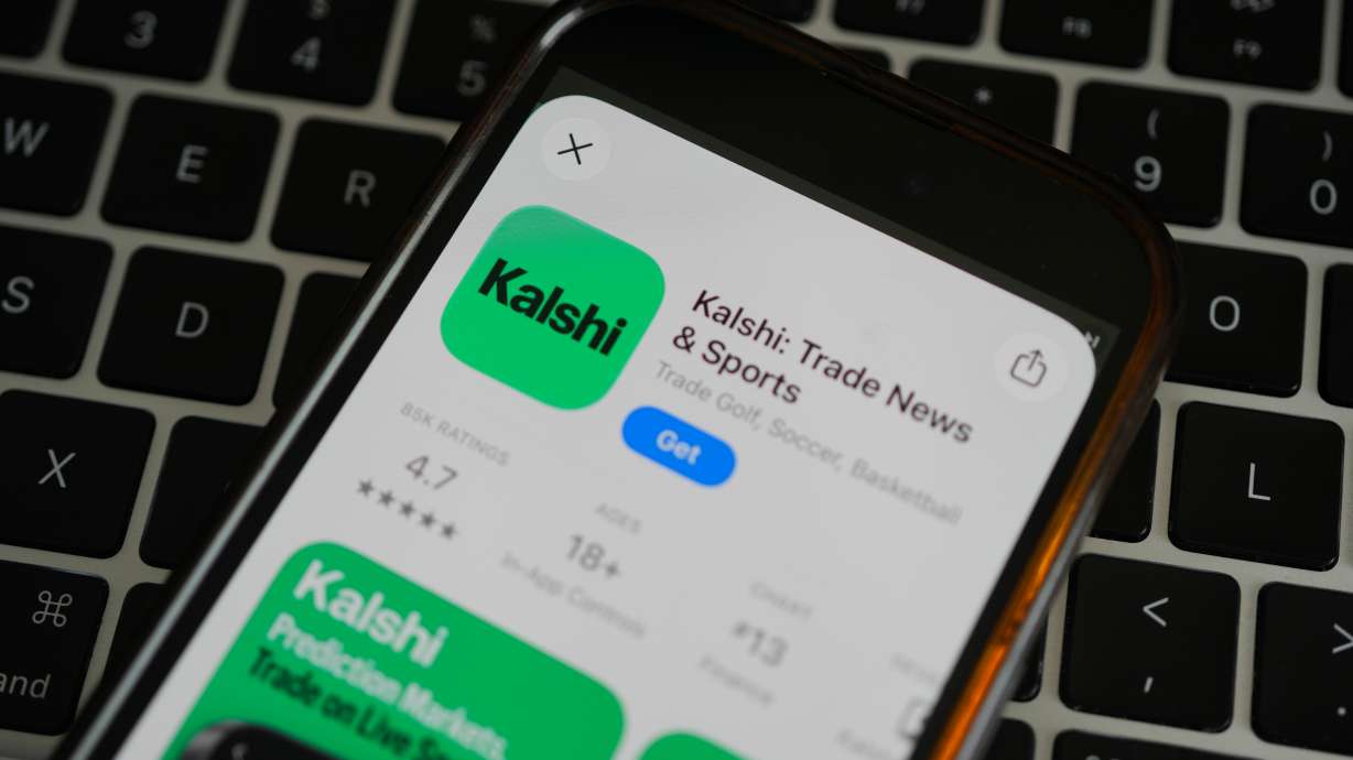 An ad for the prediction market app Kalshi is displayed on a mobile phone April 16, in Chicago.