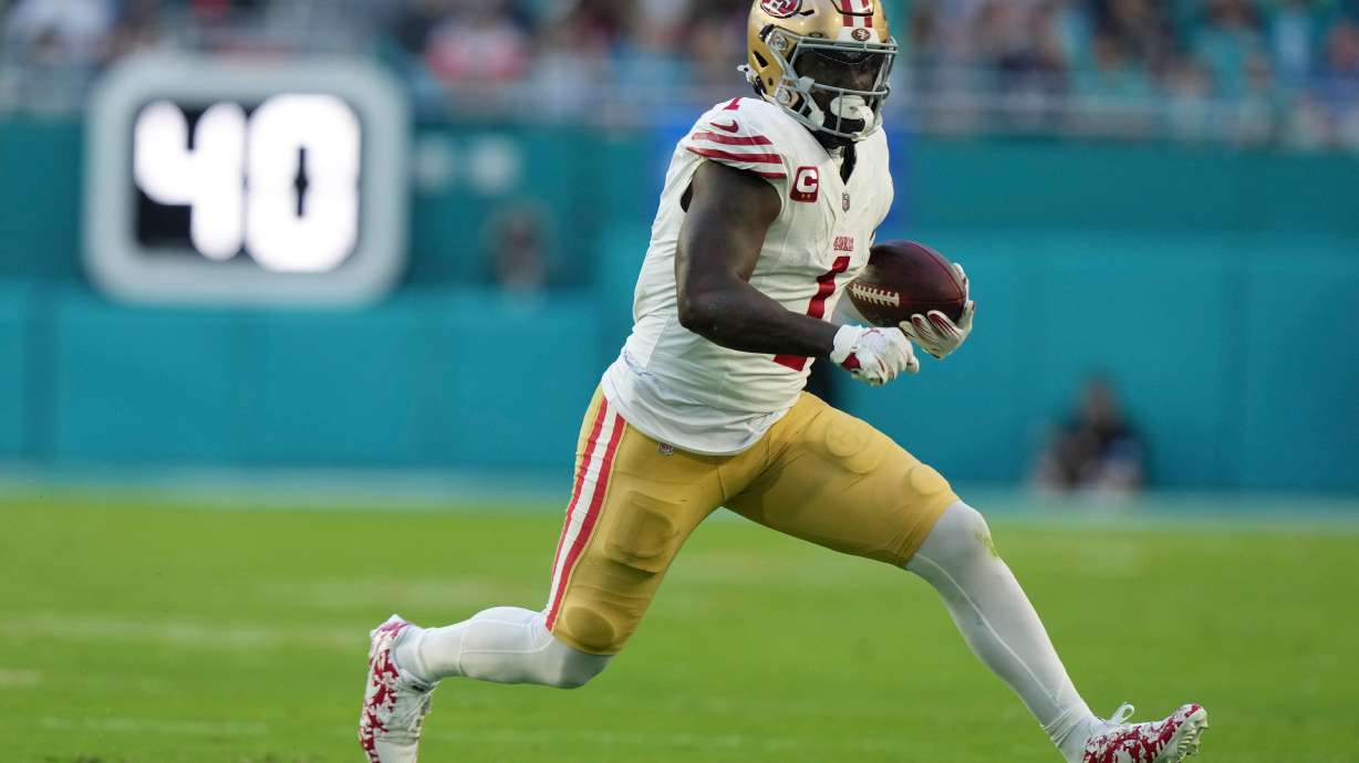FILE - San Francisco 49ers wide receiver Deebo Samuel Sr. (1) runs for a first down during the first half of an NFL football game against the Miami Dolphins, Dec. 22, 2024, in Miami Gardens, Fla.