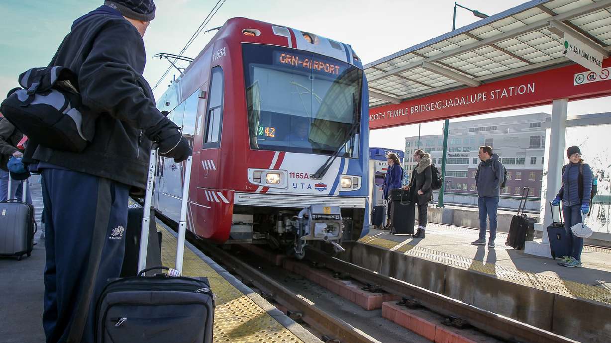 A bus bridge was put in place between the North Temple and Airport stations after a car collided with a TRAX Green Line train on Friday morning.