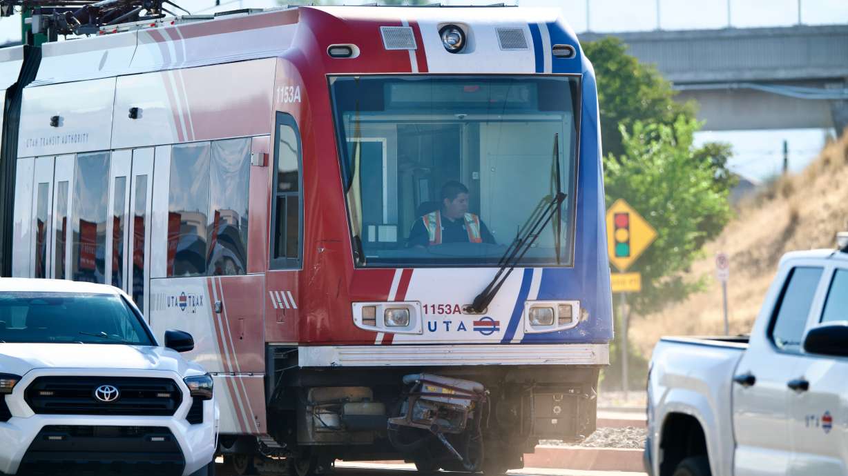 A train on TRAX's Green Line was derailed on Friday after a car collided with the train.