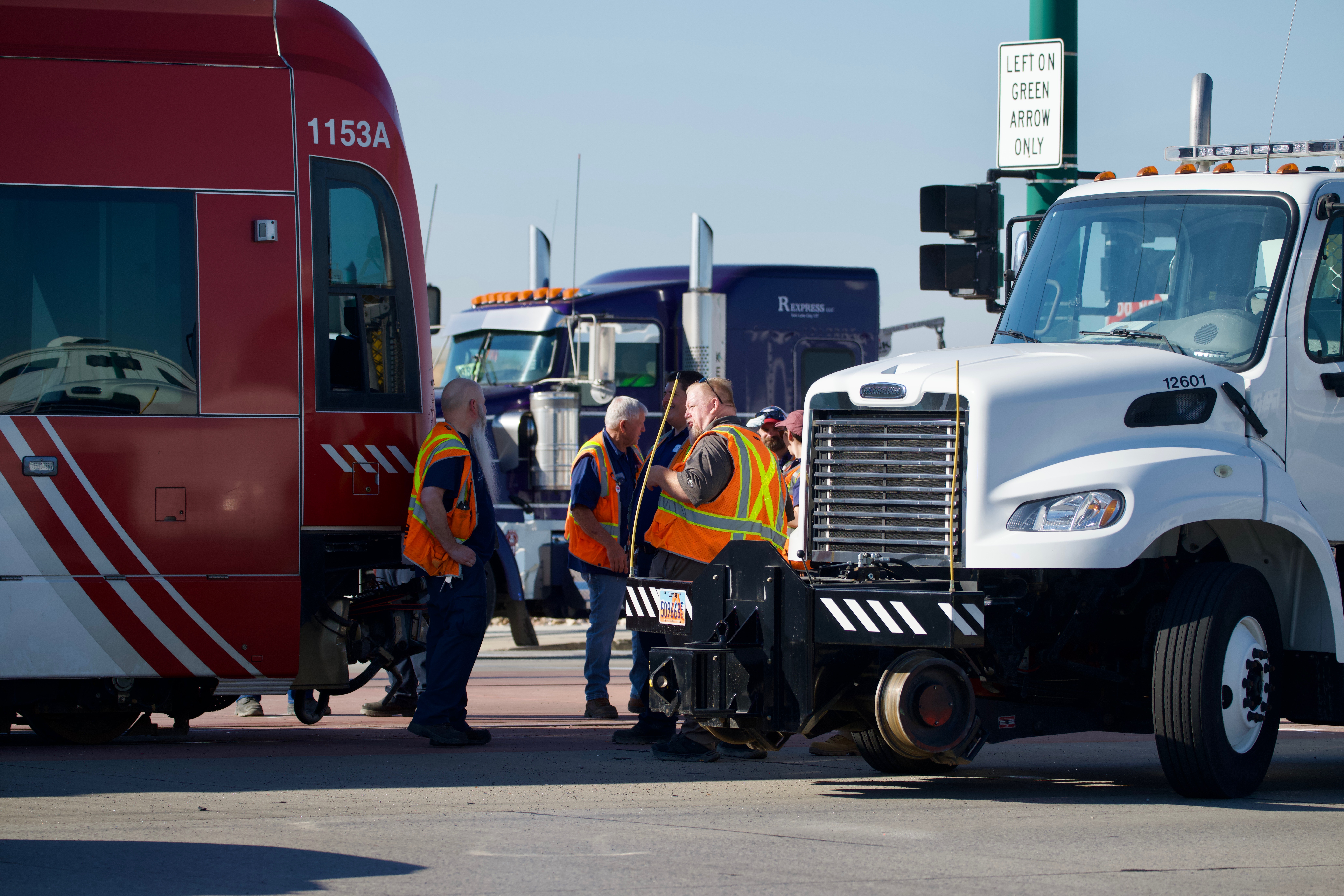 Crews work to clear debris from a crash that occurred Friday between a TRAX Green Line train and a car.