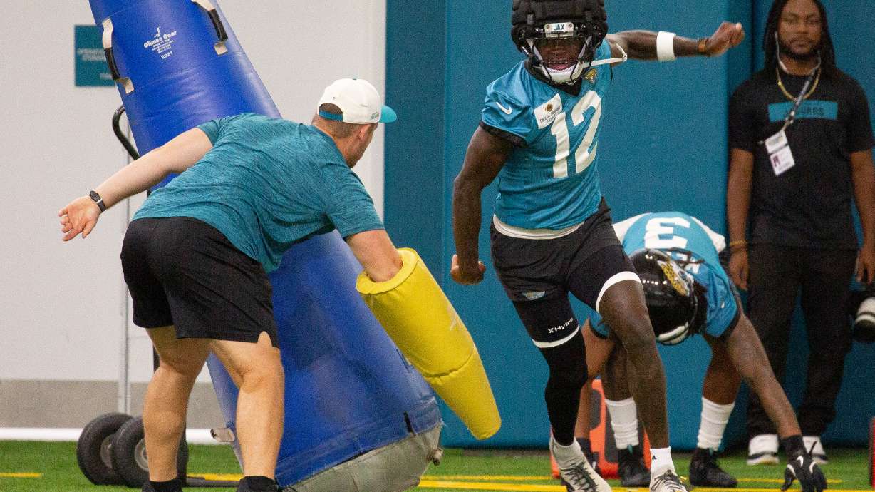 Jacksonville Jaguars wide receiver and cornerback Travis Hunter (12) particpates in drills during practice at the team's NFL football training camp, Thursday, July 30, 2026, in Jacksonville, Fla.