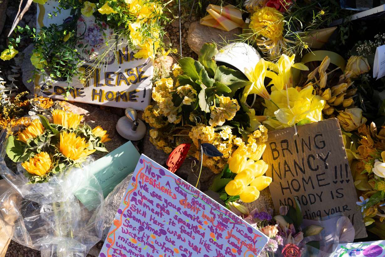 A collection of yellow flowers and notes sit at the home of Nancy Guthrie, the missing mother of "Today" show host Savannah Guthrie, in Tucson, Ariz., March 6.