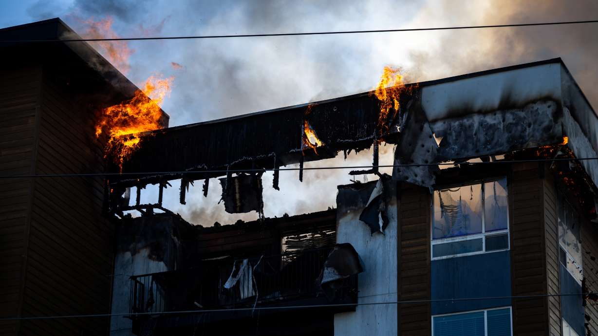 Firefighters respond to an apartment fire at 942 E. North Union Avenue near Hillcrest High School in Midvale on Friday.