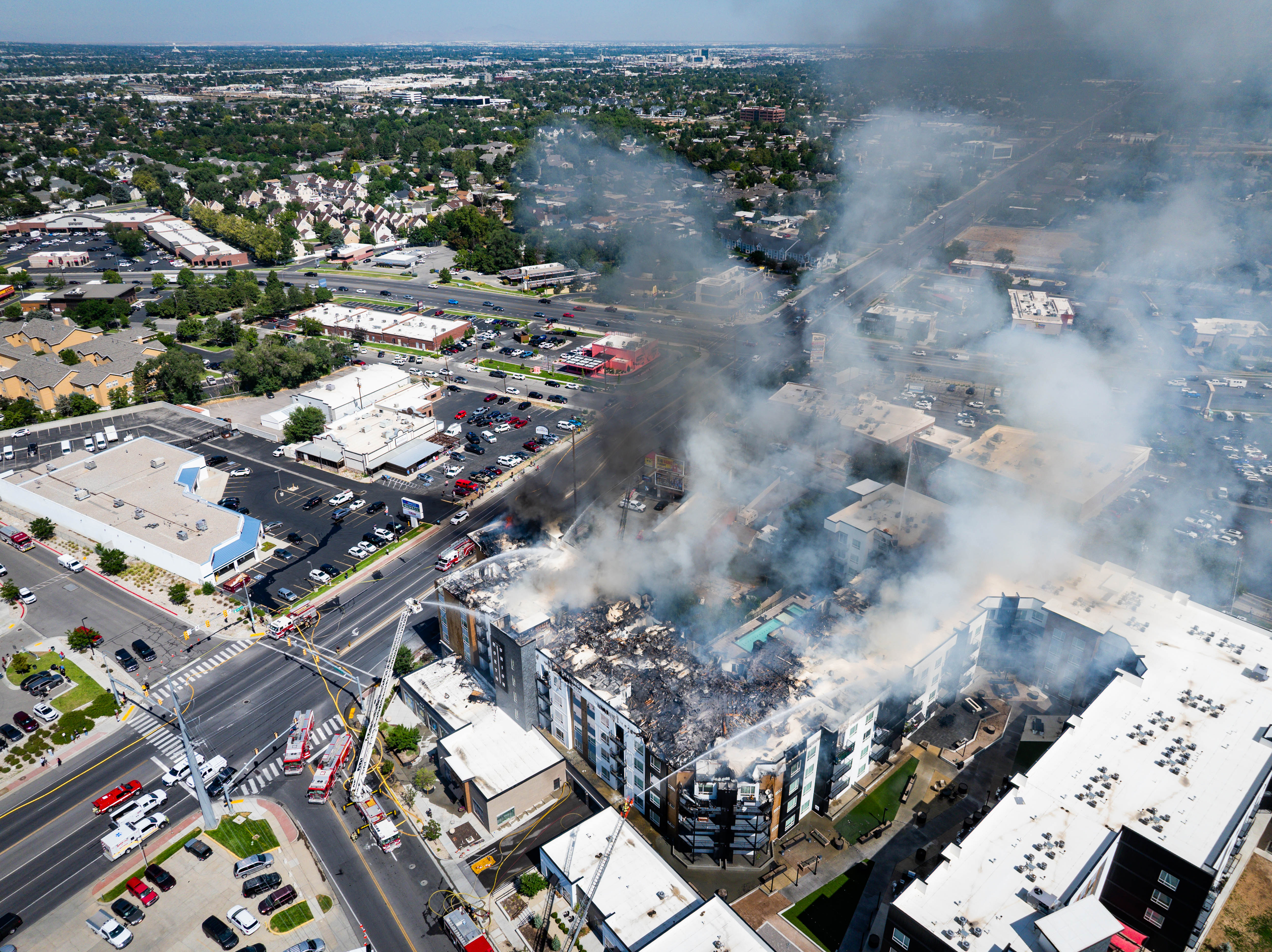 Firefighters respond to an apartment fire at 942 E. North Union Avenue, near Hillcrest High School in Midvale, on Friday.
