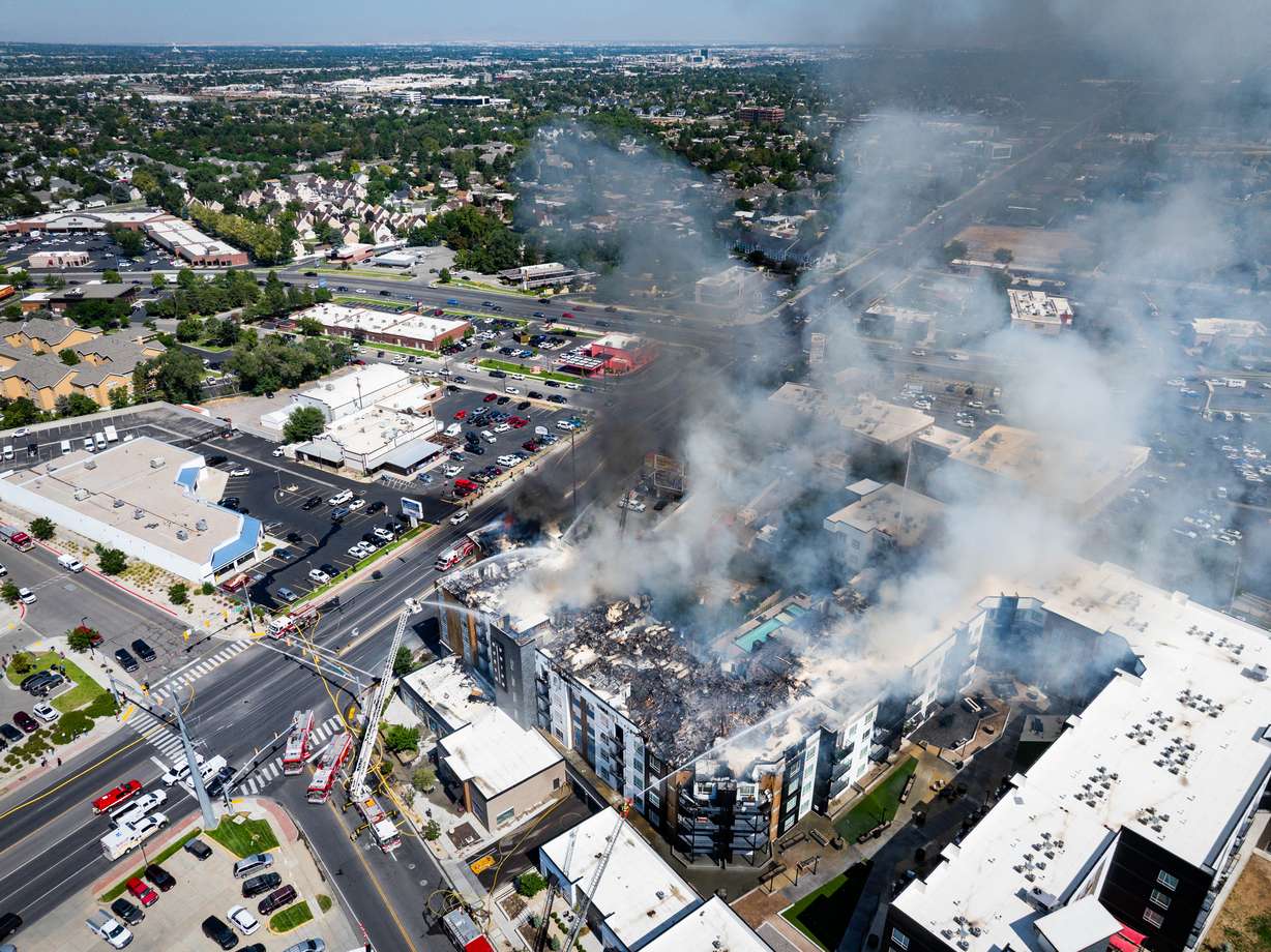Firefighters respond to an apartment fire at 942 E. North Union Avenue, near Hillcrest High School in Midvale, on Friday.