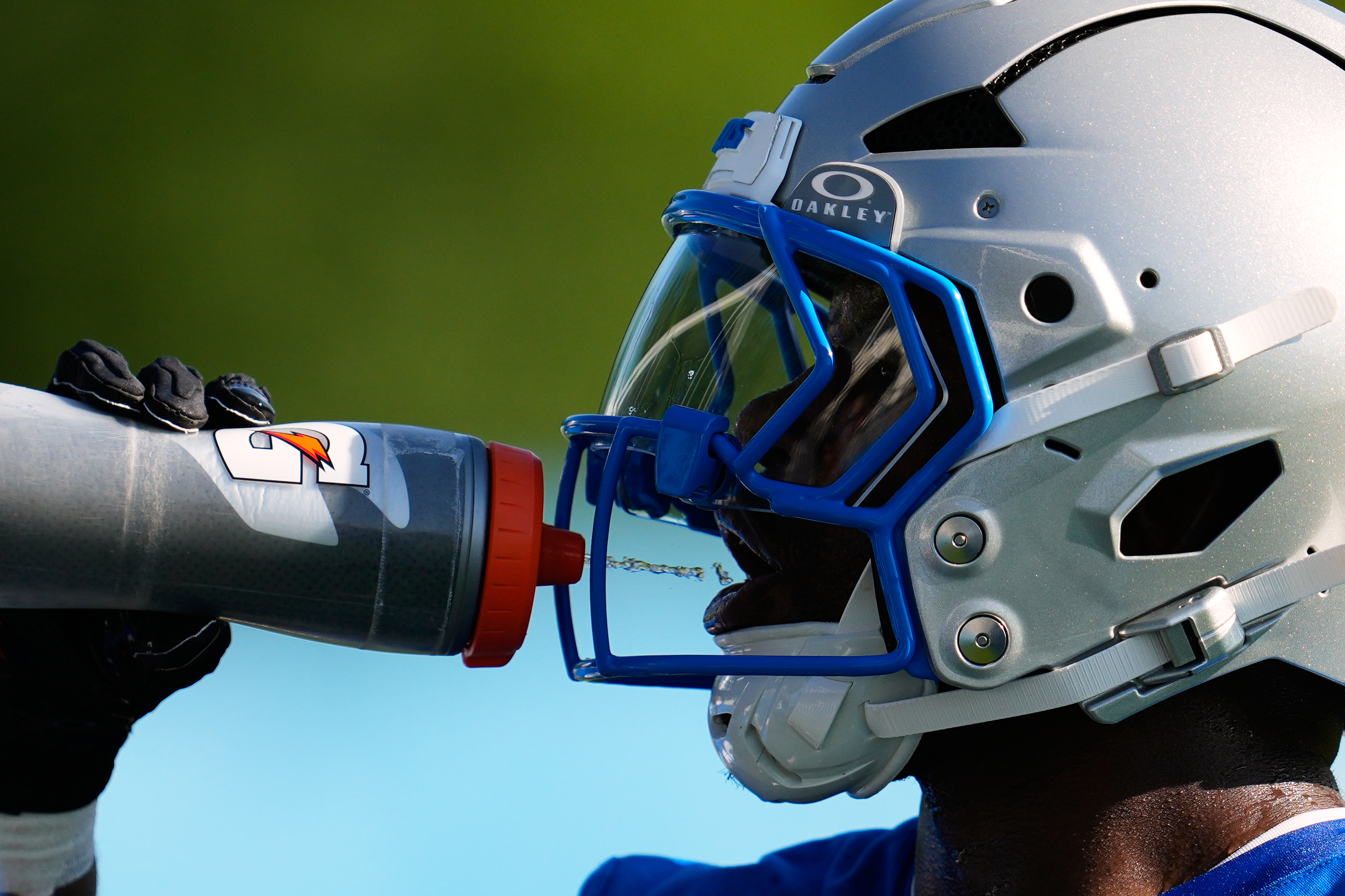 Detroit Lions running back Jabari Small drinks water to cool off from the heat during a NFL football training camp practice in Allen Park, Mich., Wednesday, July 29, 2026. 