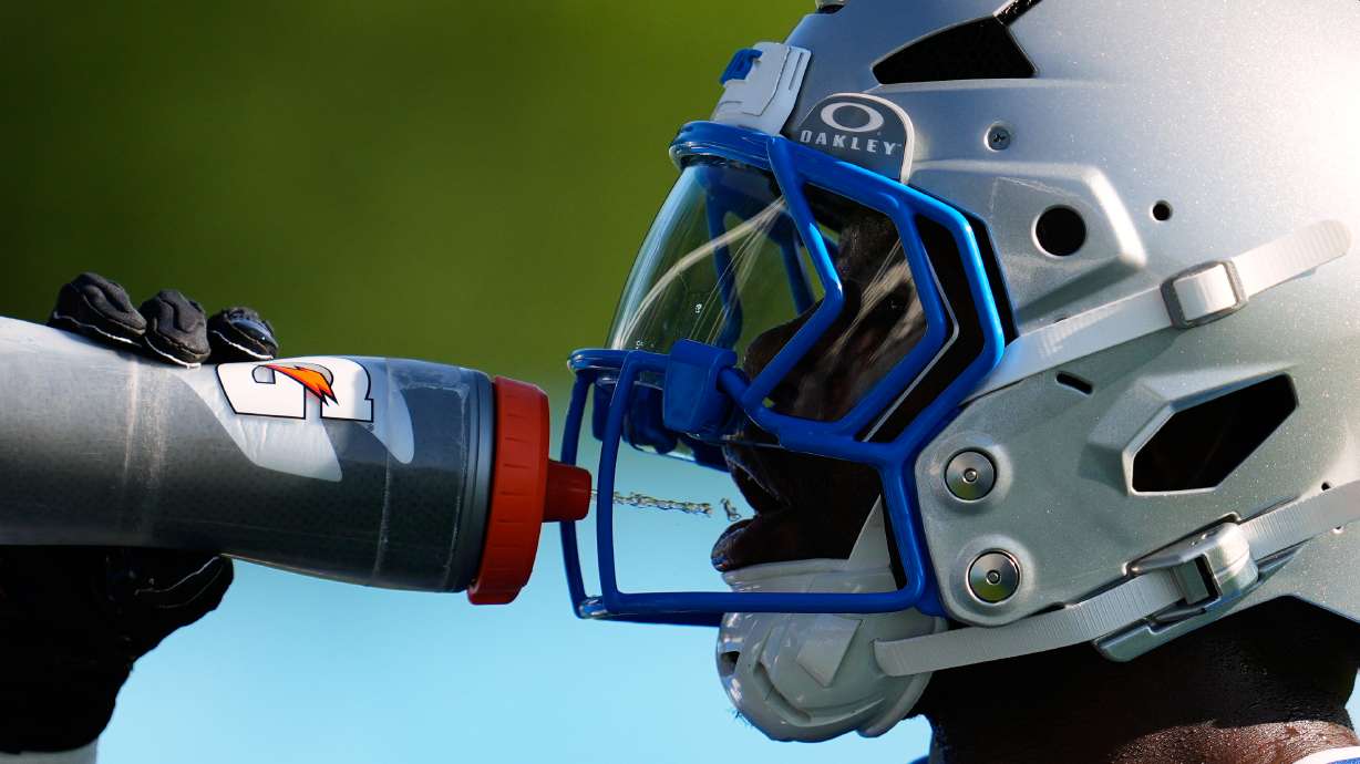 Detroit Lions running back Jabari Small drinks water to cool off from the heat during a NFL football training camp practice in Allen Park, Mich., Wednesday, July 29, 2026.