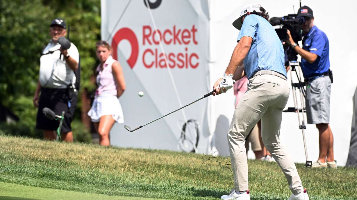 Cameron Young chips onto the eighth green during the first round of the Rocket Classic golf tournament at the Detroit Golf Club, Thursday, July 30, 2026, in Detroit.