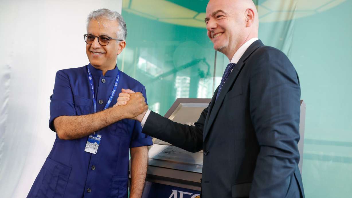 FILE - Asia Football Confederation President Salman Bin Ibrahim Al-Khalifa, left, poses with FIFA President Gianni Infantino during an inauguration ceremony for the new building of the Asia Football Confederation in Kuala Lumpur, Malaysia Tuesday, Oct. 30, 2018.