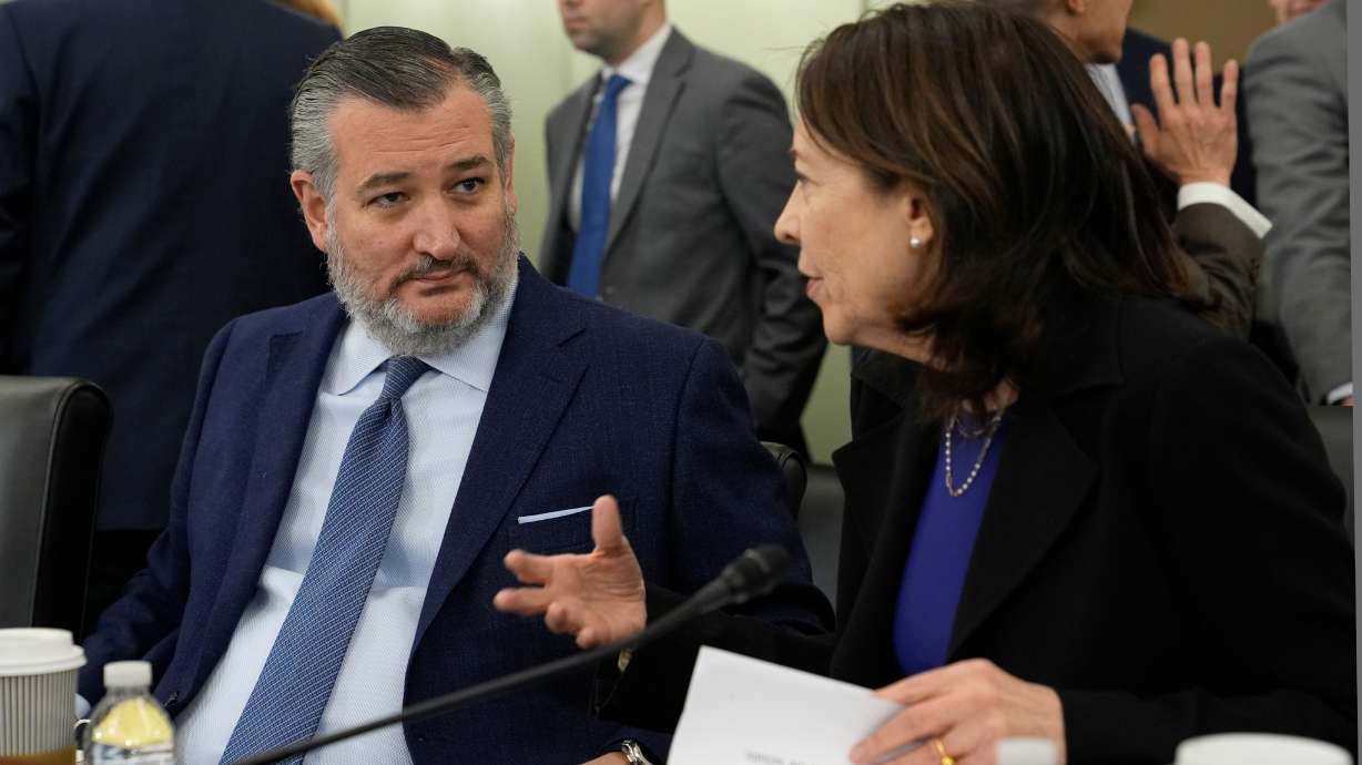 FILE - Senate Commerce, Science, and Transportation Committee Chair Sen. Ted Cruz, R-Texas, left, talks with ranking member Sen. Maria Cantwell, D-Wash., right, before the start a hearing on Capitol Hill in Washington, Wednesday, Jan. 15, 2025.