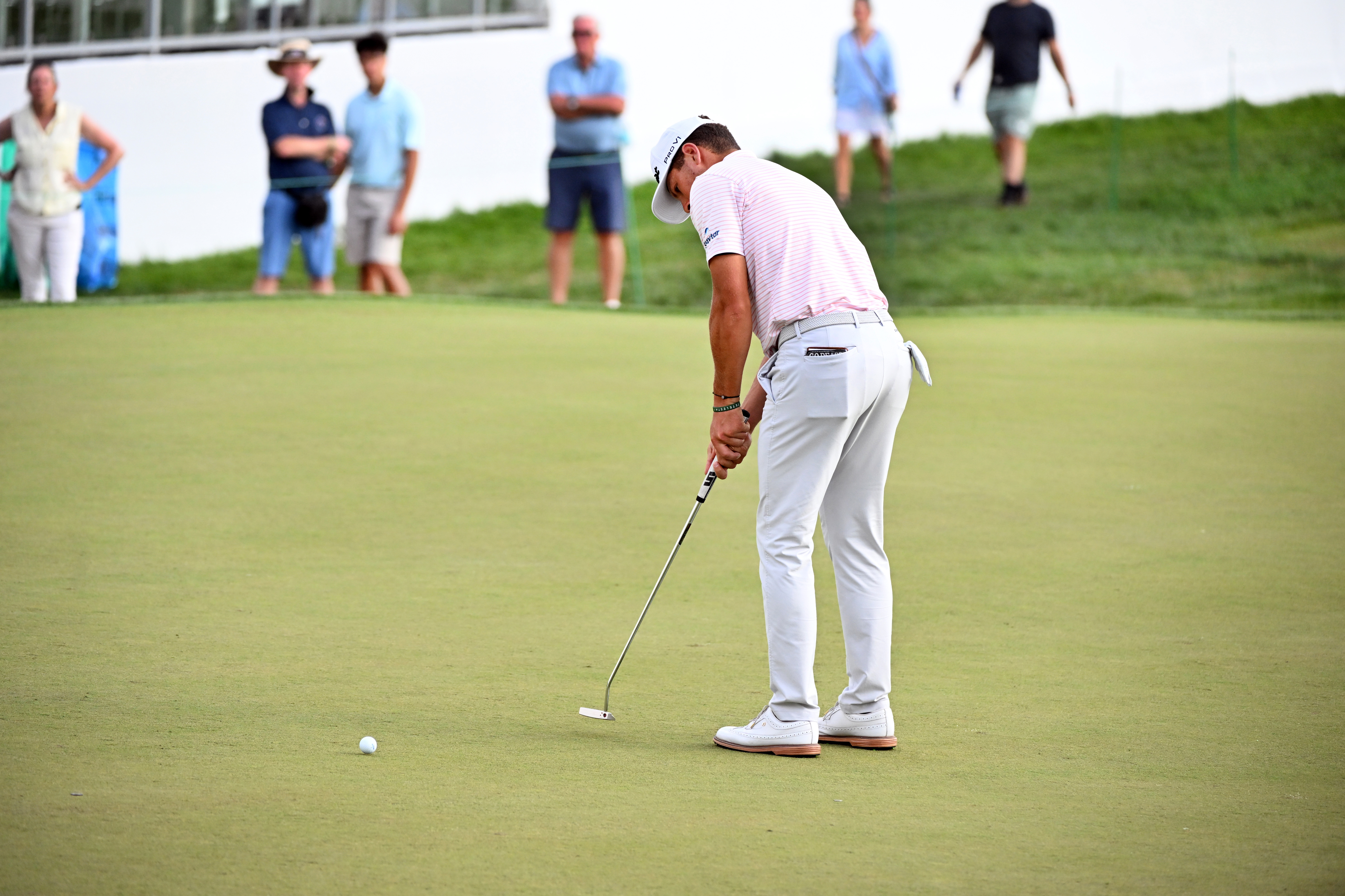 Michael Brennan putts on the 18th green during the first round of the Rocket Classic golf tournament at the Detroit Golf Club, Thursday, July 30, 2026, in Detroit. 