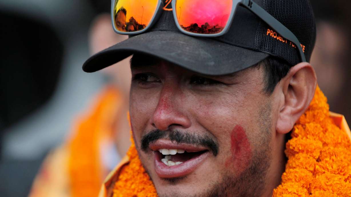 Nepalese mountaineer Nirmal Purja, who became the fastest climber of the world's 14 highest peaks, arrives at the airport in Kathmandu, Nepal, on Oct. 30, 2019.