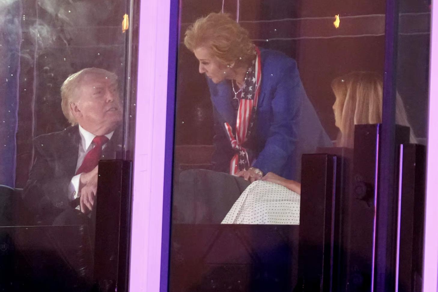 President Donald Trump, left, speaks with Education Secretary Linda McMahon during a fireworks show at Salute to America, an Independence Day event honoring the nation's 250th anniversary, July 5, on the National Mall in Washington.