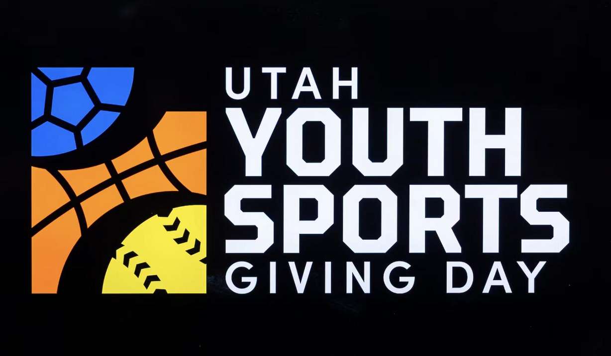 The Utah Youth Sports Giving Day logo is displayed during a kick-off event for the initiative held at The Ballpark at America First Square in South Jordan on June 5.