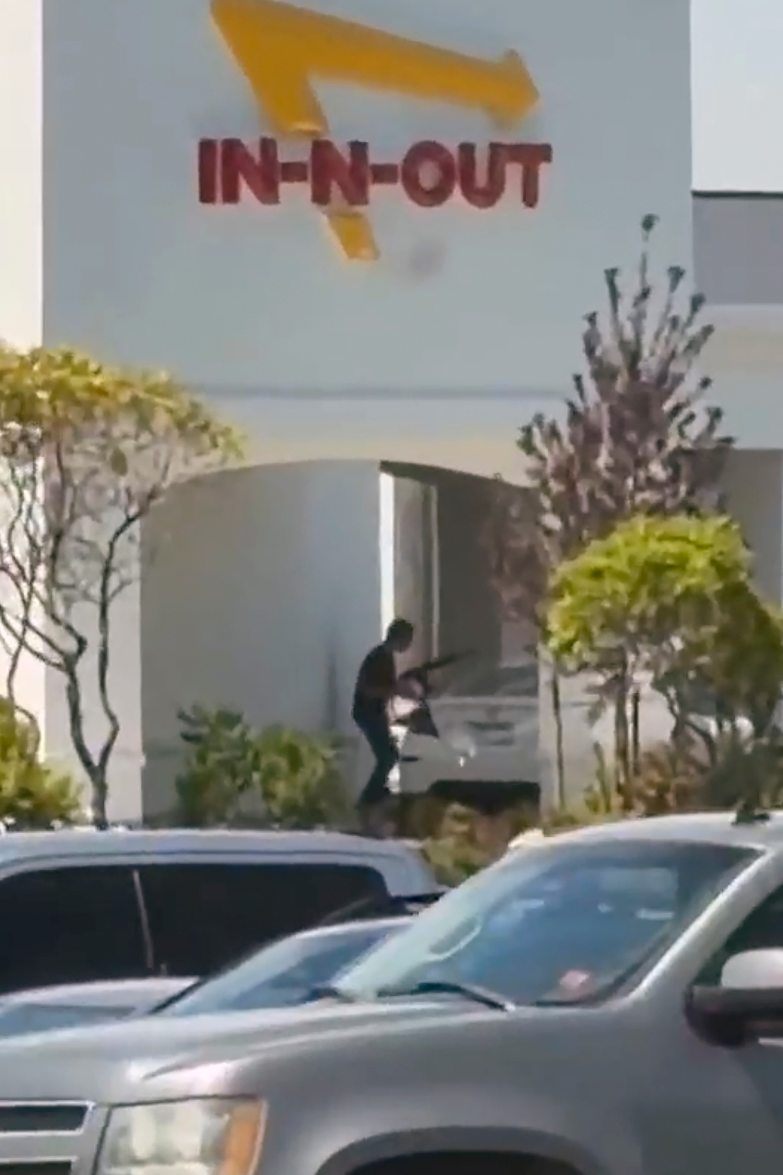 This still image captured from video by a witness shows the scene of a shooting that started at an In-N-Out Burger restaurant on Saturday in Twin Falls, Idaho.