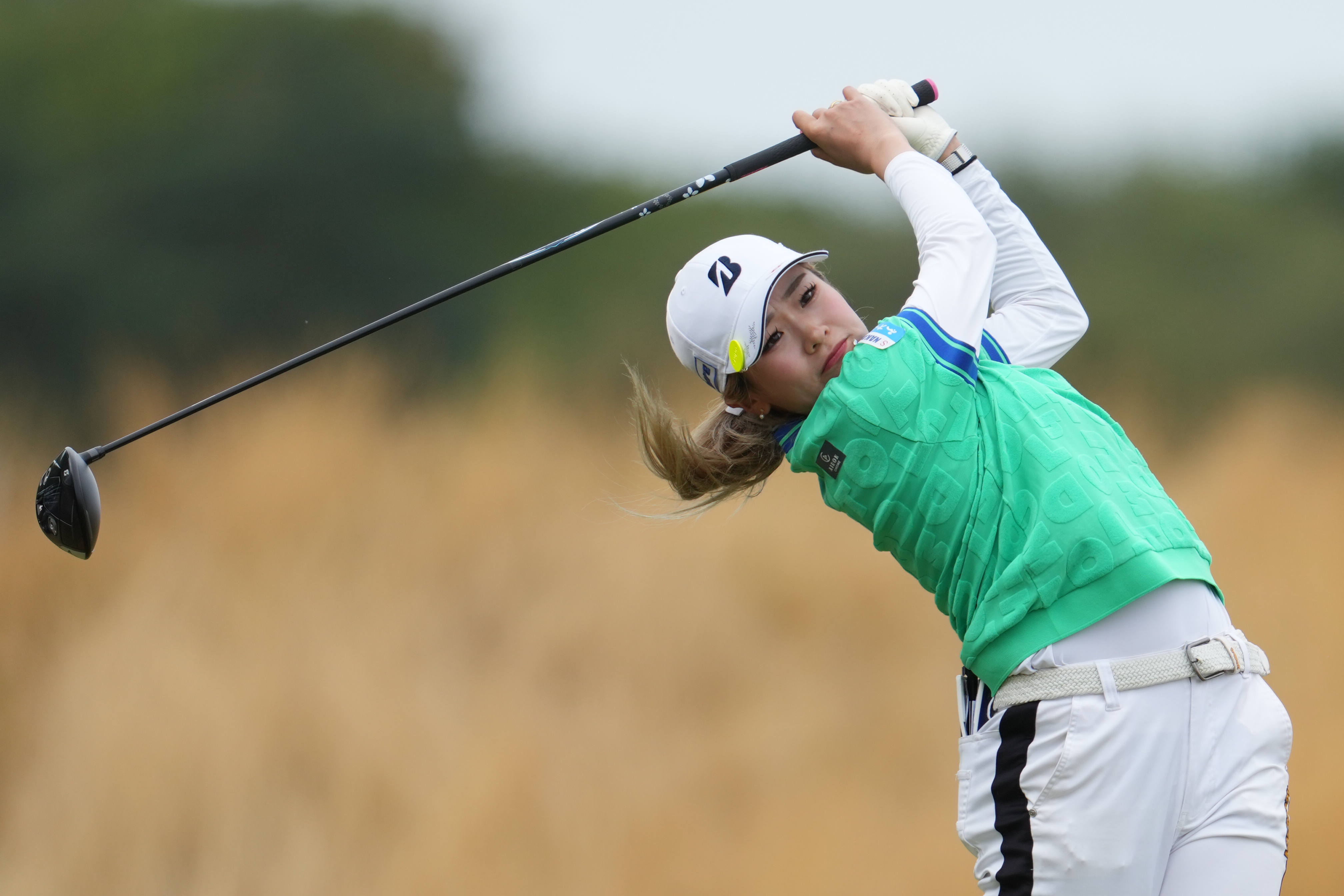 Shiho Kuwaki, of Japan, drives off the 3rd tee during the fourth round of the Women's British Open golf championship in Lytham St Annes, England, Sunday, Aug. 2, 2026. 