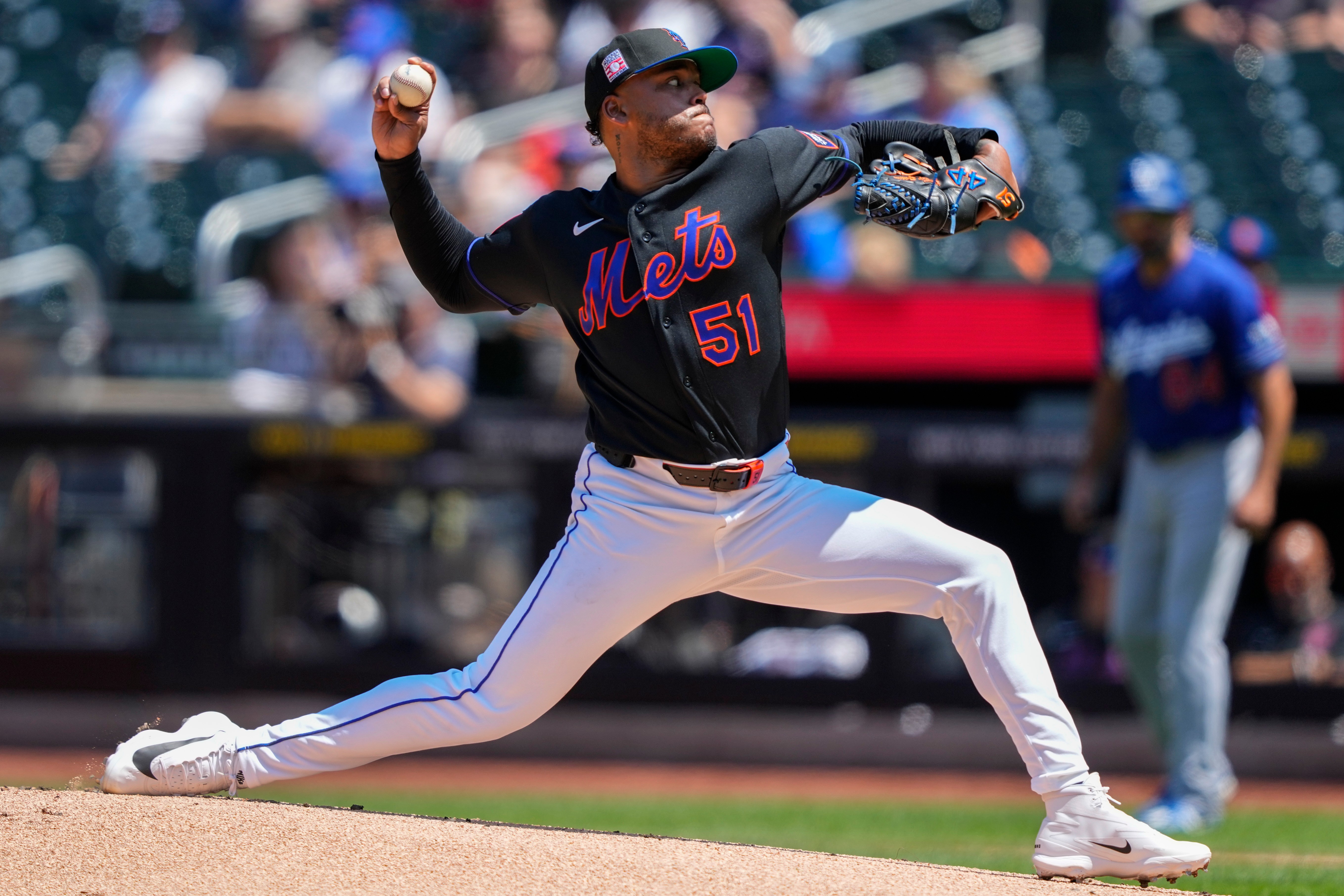 New York Mets pitcher Freddy Peralta (51) throws during the first inning of a baseball game against the Los Angeles Dodgers, Sunday, July 26, 2026, in New York. 