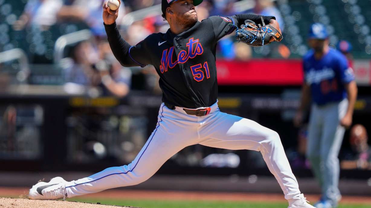 New York Mets pitcher Freddy Peralta (51) throws during the first inning of a baseball game against the Los Angeles Dodgers, Sunday, July 26, 2026, in New York.