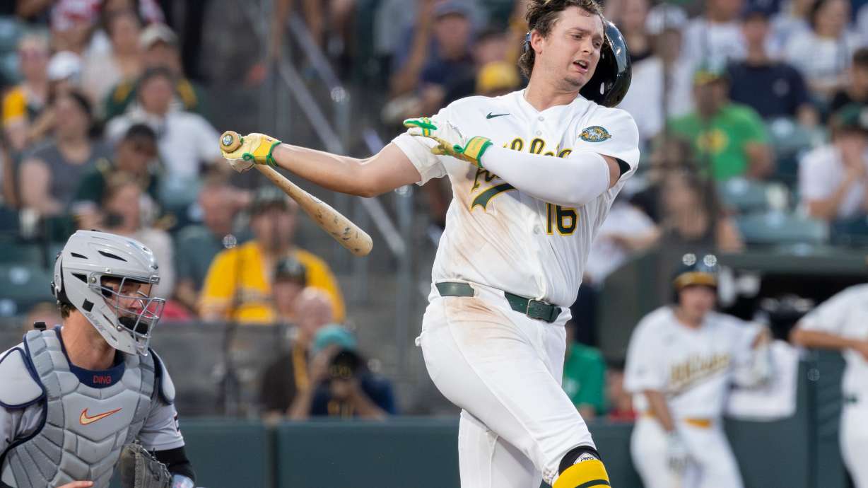 Athletics' Nick Kurtz loses his batting helmet on a swing during the fifth inning of a baseball game against the Detroit Tigers, Friday, July 31, 2026, in West Sacramento, Calif.