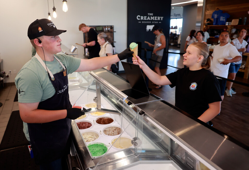 Gabe Robinson serves a cone of ice cream to Cincy Wright at The Creamery in Beaver on Thursday, July 9, 2026.