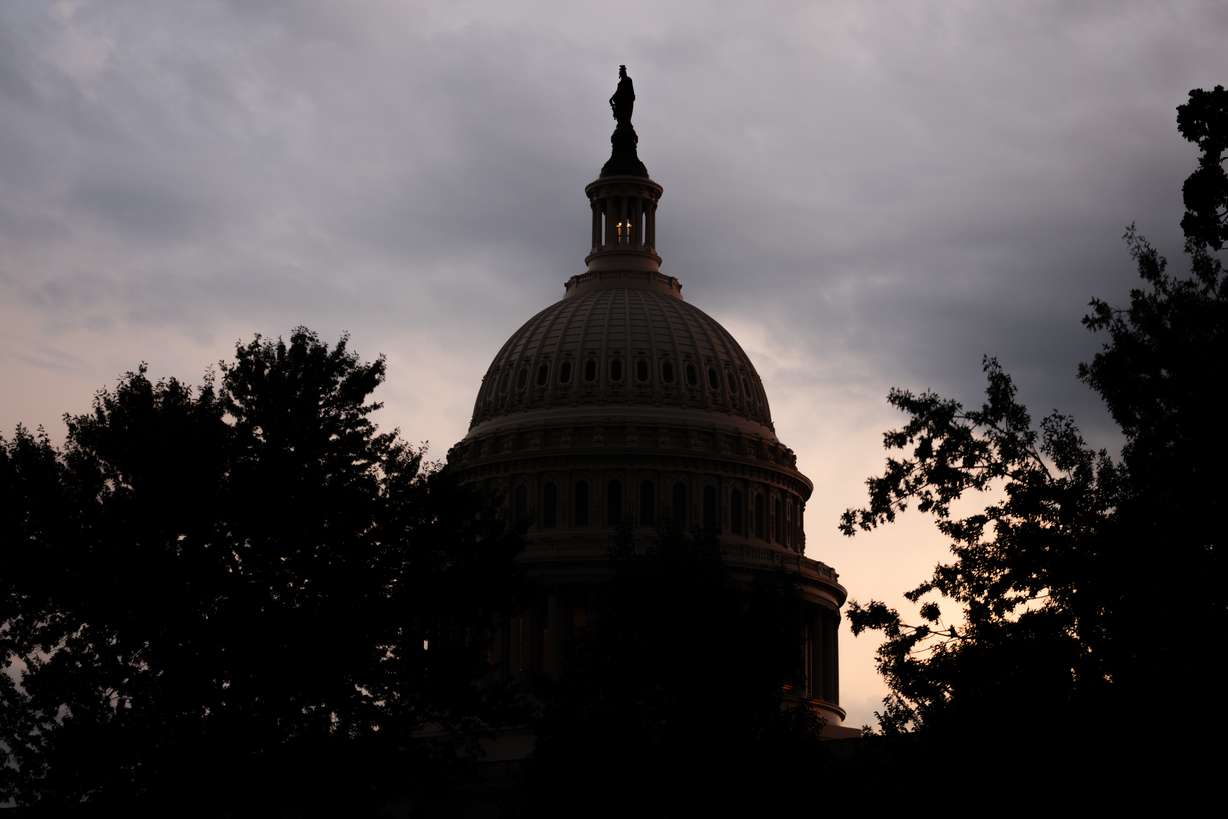 The sun sets behind the Capitol, July 28, in Washington. Republicans are putting their weight into an effort to delay recess until the Senate passes Sen. Mike Lee's SAVE America Act.