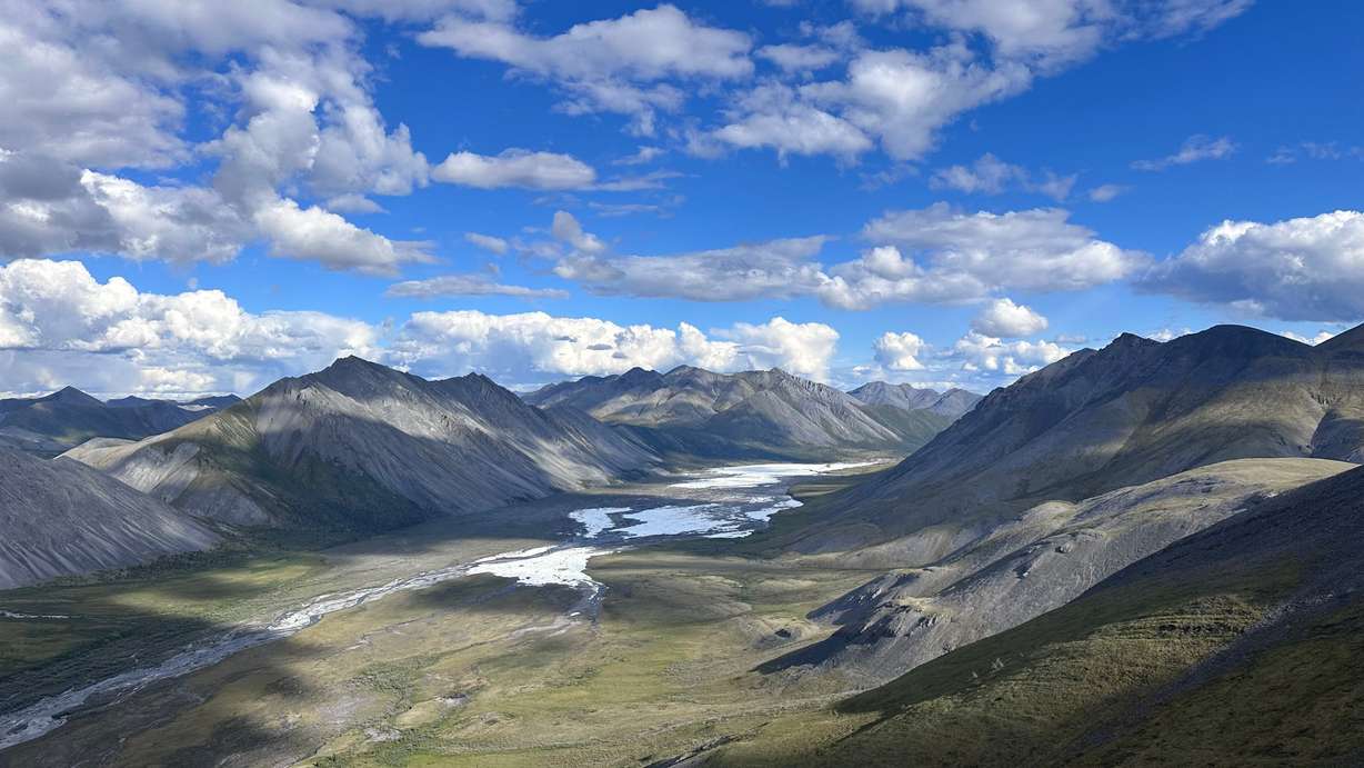 A view south from the summit of an unnamed peak in Alaska toward creeks still frozen on July 1.