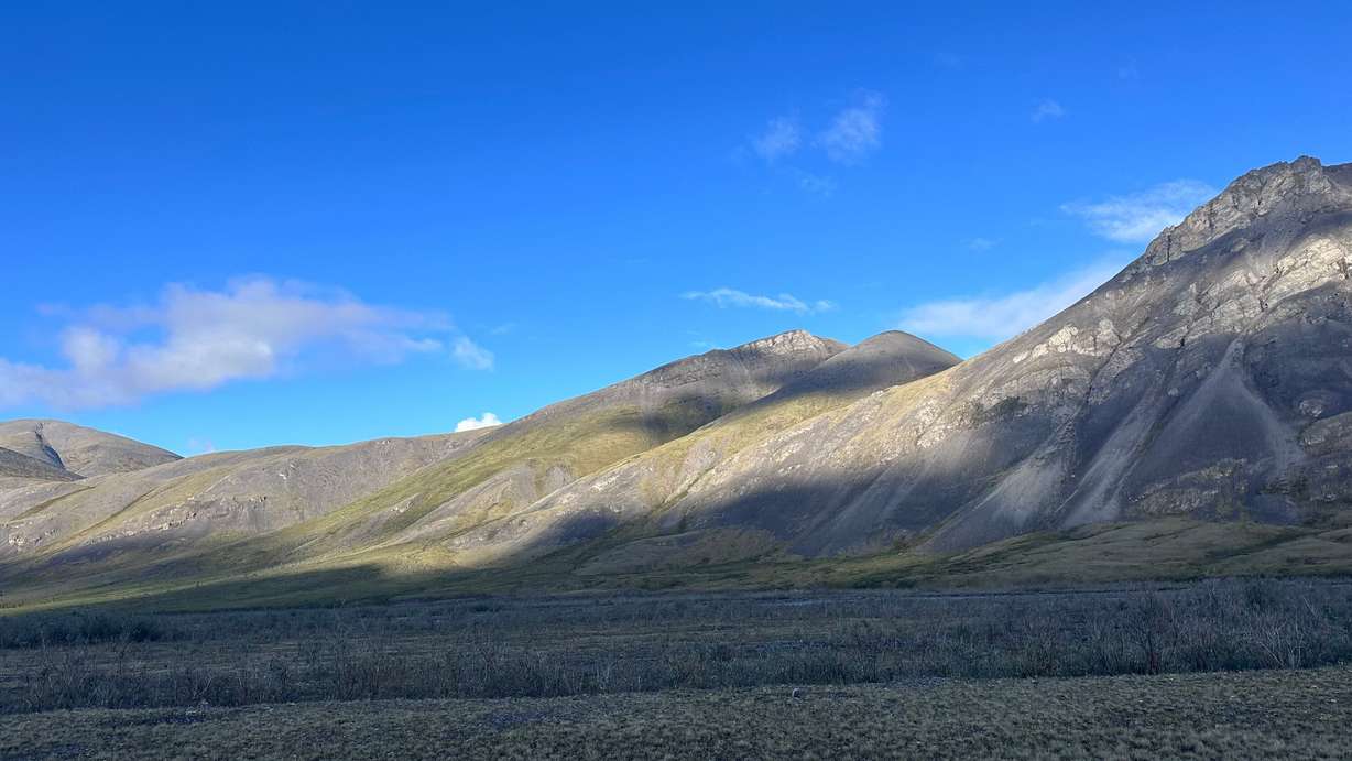 Morning sunlight dances on three unnamed peaks in the Arctic National Wildlife Refuge in Alaska on July 1.