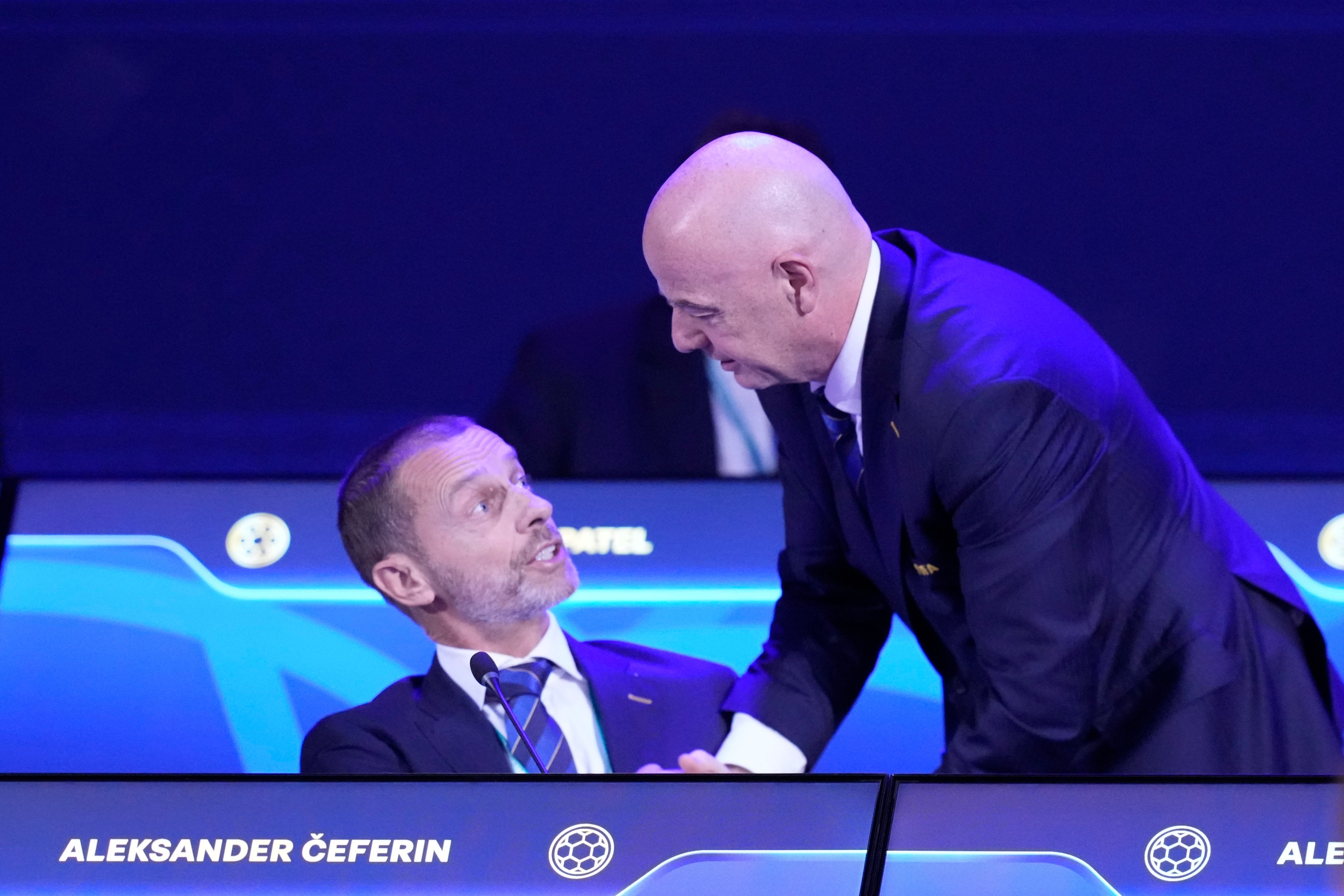FILE - FIFA President Gianni Infantino, right, talks to UEFA President Aleksander Ceferin during the FIFA 75th Congress at the Conmebol Convention Center in Luque, Paraguay, Thursday, May 15, 2025. 