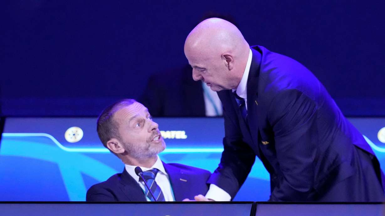 FILE - FIFA President Gianni Infantino, right, talks to UEFA President Aleksander Ceferin during the FIFA 75th Congress at the Conmebol Convention Center in Luque, Paraguay, Thursday, May 15, 2025.
