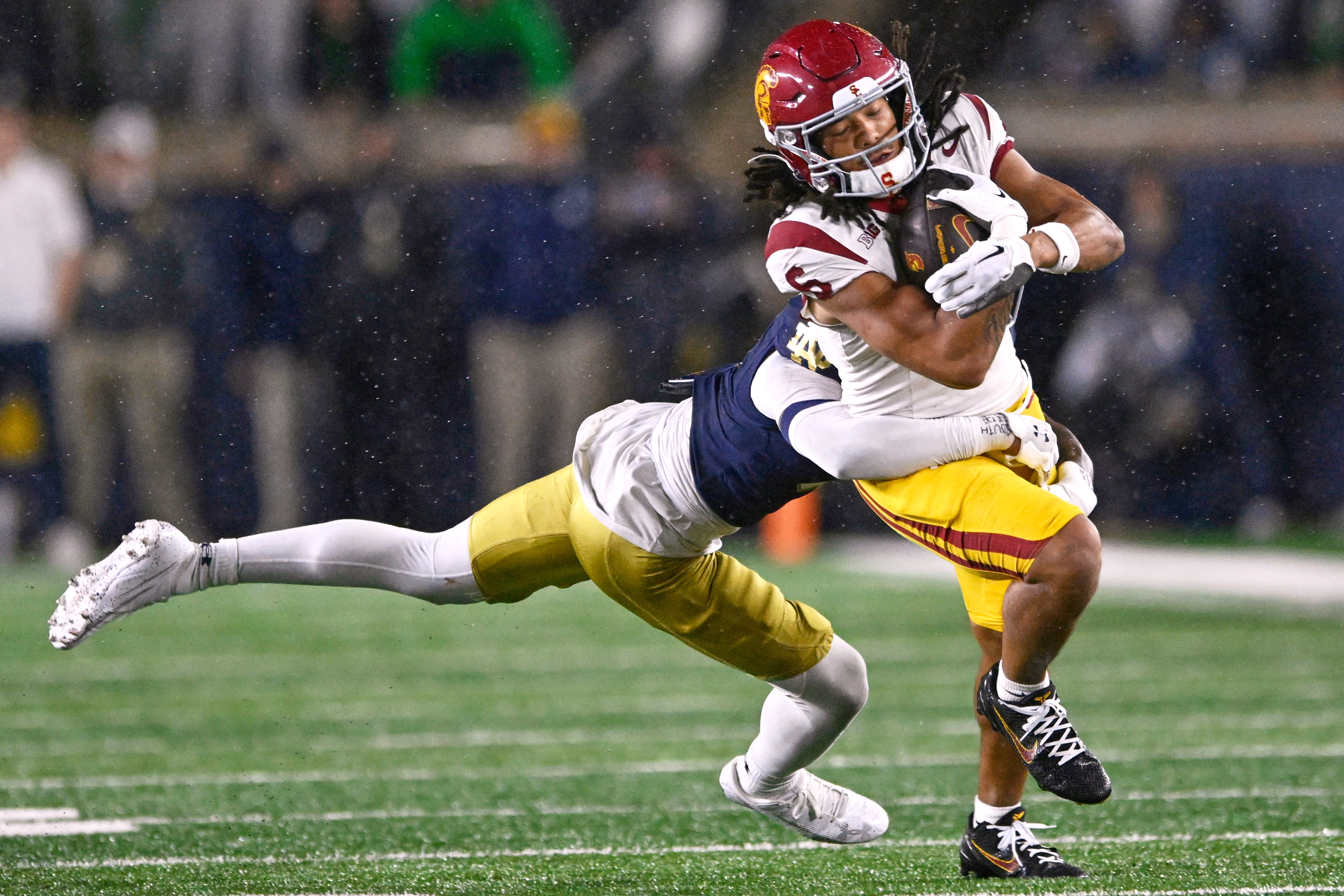 FILE - Southern California wide receiver Makai Lemon (6) catches a pass against Notre Dame's Tae Johnson (9) during the fourth quarter of an NCAA college football game, Oct. 18, 2025, in South Bend, Ind. 