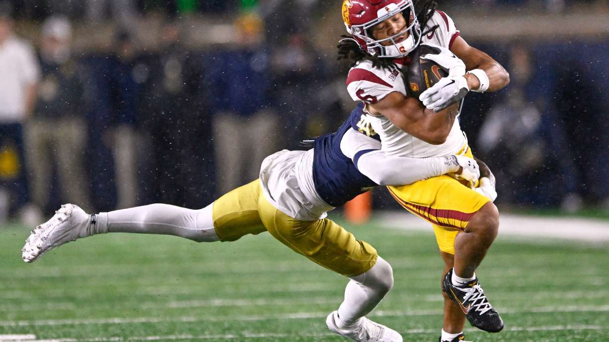 FILE - Southern California wide receiver Makai Lemon (6) catches a pass against Notre Dame's Tae Johnson (9) during the fourth quarter of an NCAA college football game, Oct. 18, 2025, in South Bend, Ind.