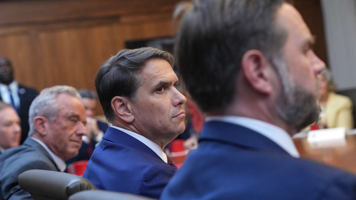 Health and Human Services Secretary Robert F. Kennedy Jr., from left, acting Attorney General Todd Blanche and Vice President JD Vance attend a cabinet meeting, Friday at Camp David, the presidential retreat, near Thurmont, Md.