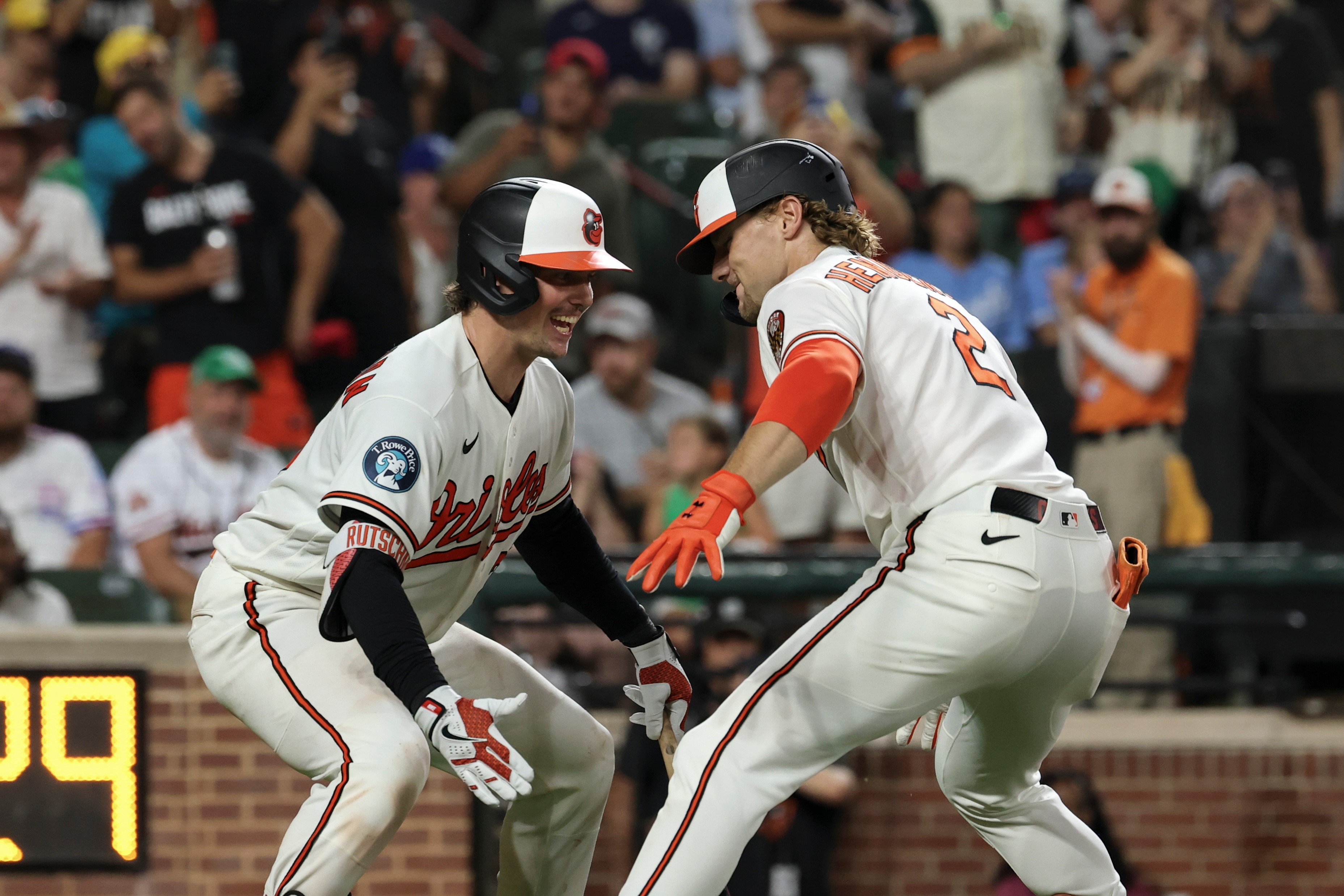Baltimore Orioles' Gunnar Henderson (2) celebrates with Adley Rutschman, left, after hitting a home run off Kansas City Royals pitcher Eli Morgan during the eighth inning of a baseball game, Saturday, July 11, 2026, in Baltimore. 