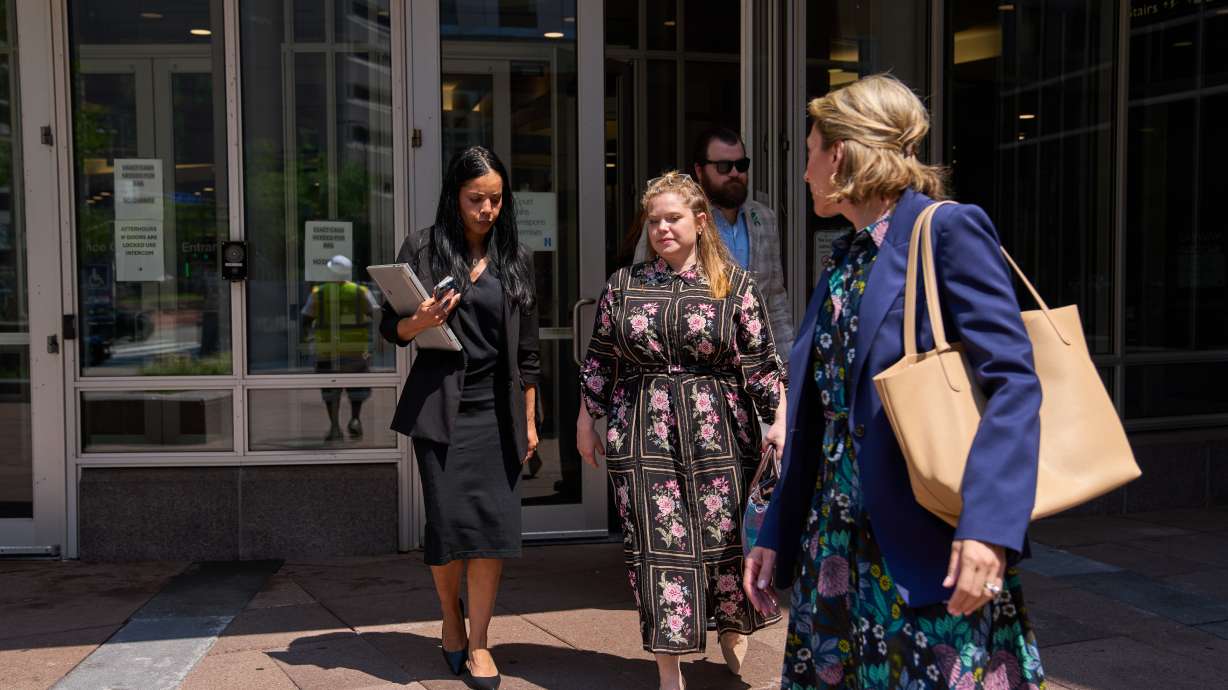 Colin Hortman, behind, son of Melissa and Mark Hortman, and his wife Alina Bachman Hortman, second from left, leave after attending the initial state court appearance for Vance Boelter on Monday in Minneapolis.