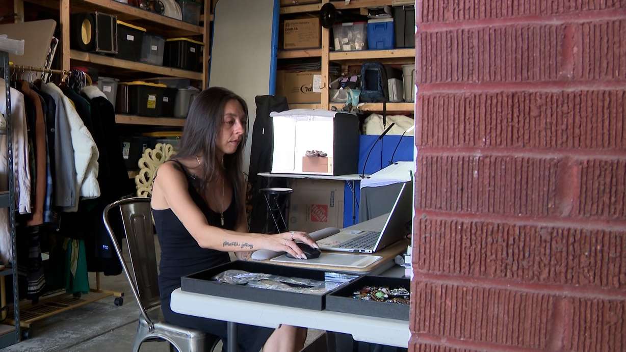 Kristen Ingham works from the garage where she sorts, researches, photographs and lists merchandise for Salt Lake Resellers.