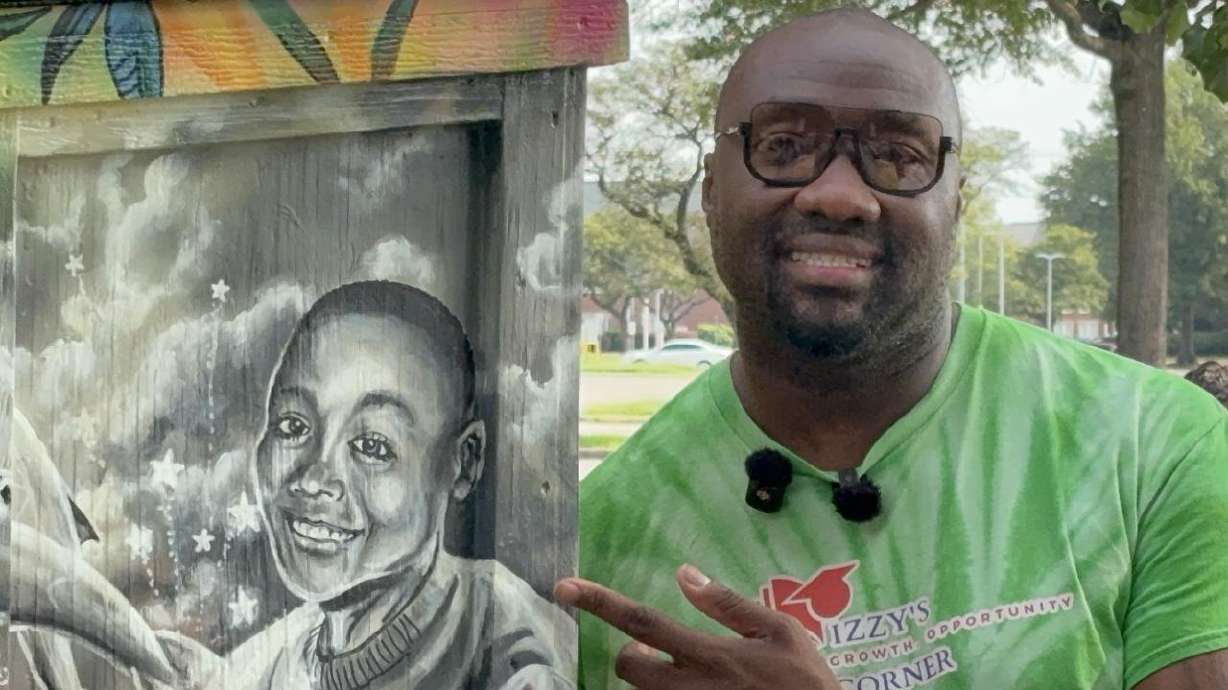 Deshawn Parker is pictured by "Izzy's Corner" in Norfolk, Virginia, which honors his son, Israel, who died in 2017.