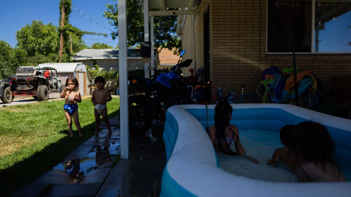 The Ruiz children play in the pool in the Rose Park neighborhood during a hot summer day in Salt Lake City on July 11. A new Utah study seeks to find any relationships between air quality, heat and family dynamics.