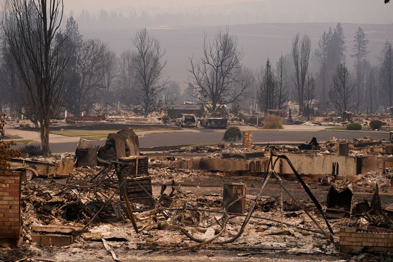 Arson suspect arrested as wildfires rage around Spokane, Washington