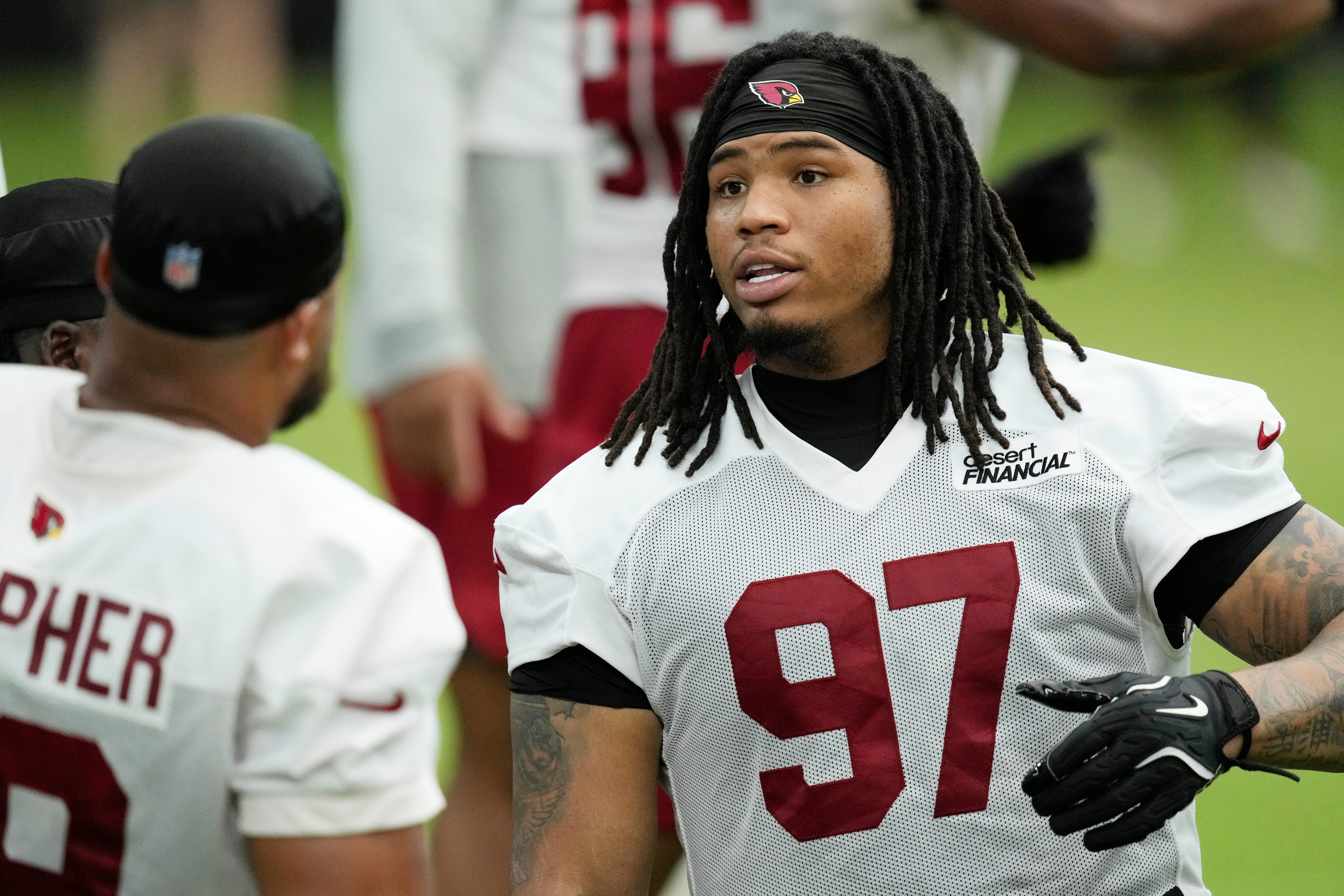 Arizona Cardinals defensive tackle Walter Nolen III (97) talks with Cardinals defensive tackle PJ Mustipher during NFL football training camp, Sunday, July 26, 2026, in Glendale, Ariz. 